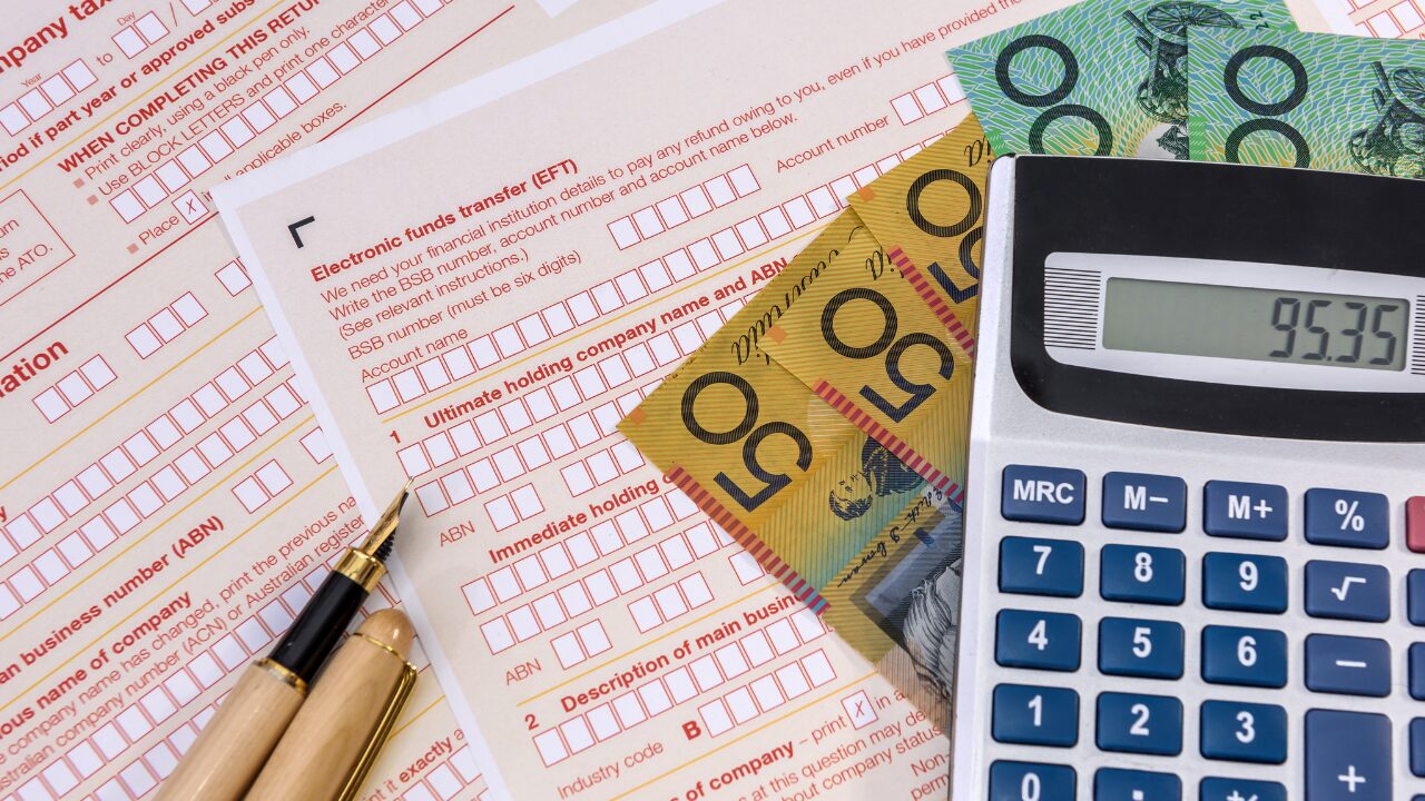 Financial documents and Australian currency highlight the importance of managing your offset account effectively.
